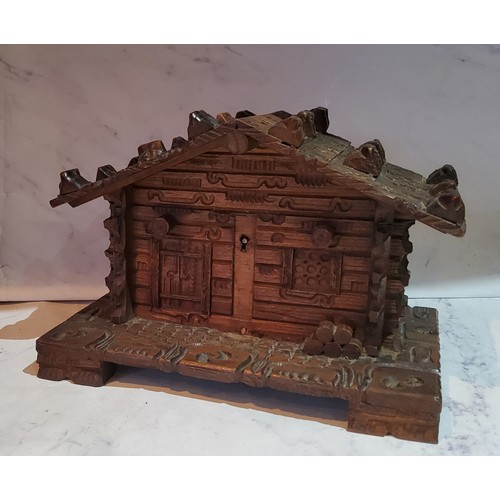 46 - A Black Forest novelty jewellery box, in the form of a chalet, 13.5cm high