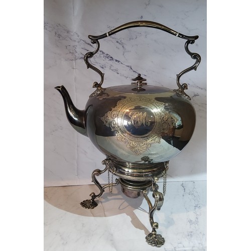 62 - A Victorian E.P.N.S. globular spirit kettle on stand, engraved with circular cartouche and scrolling... 