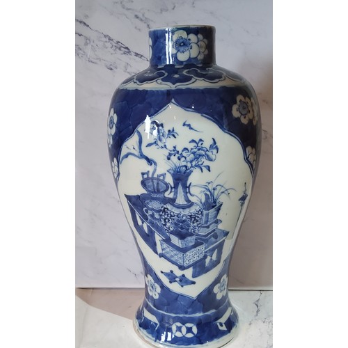 89 - A large 19th century Chinese ovoid vase, decorated in underglaze blue with vase and precious objects... 