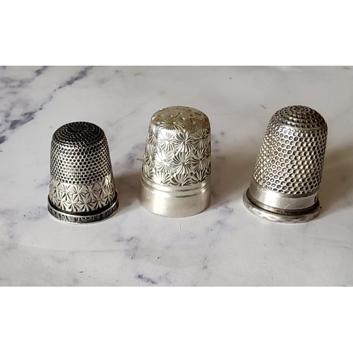 149 - A silver thimble, engraved with foliage, Charles Horner; others (3)