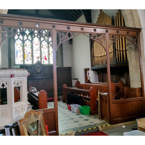 2 - A Victorian carved oak ecclesiastical rood screen with three open archways leading to the chancel an... 