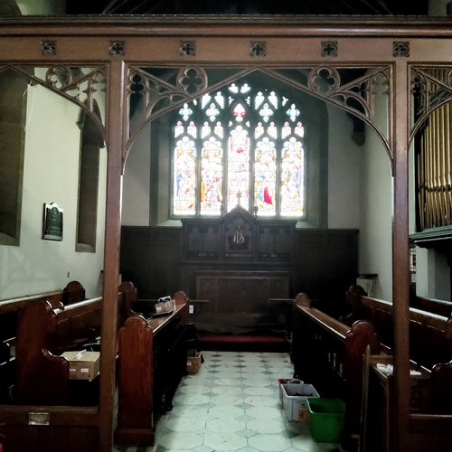 2 - A Victorian carved oak ecclesiastical rood screen with three open archways leading to the chancel an... 