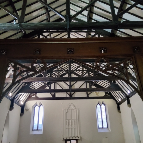 2 - A Victorian carved oak ecclesiastical rood screen with three open archways leading to the chancel an... 