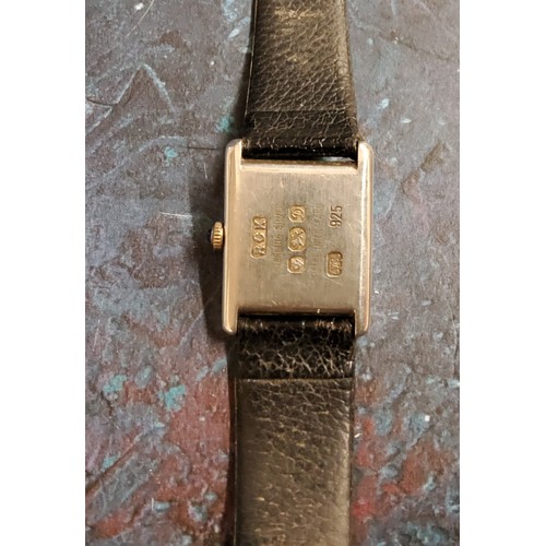 211 - A Roy King silver wristwatch, black rectangular dial, leather strap, London 1978