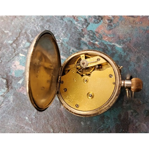 288 - A silver open faced pocket watch, Roman numerals, the case engraved with foliate scrolls, top wind