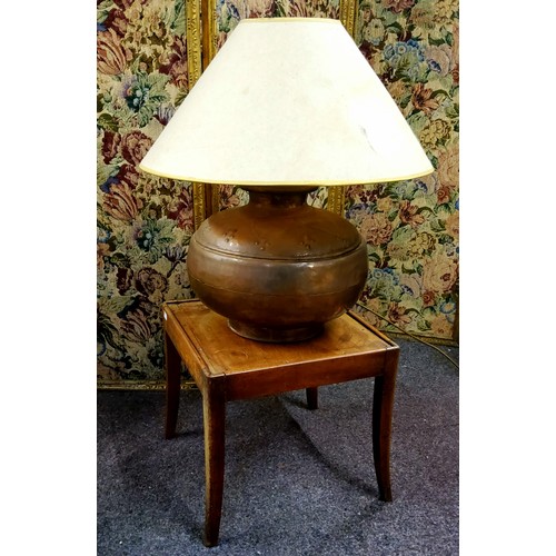 621 - A substantial Middle Eastern copper table lamp; a small 19th century mahogany occasional table (2)