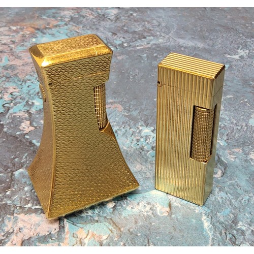 202A - A Dunhill Deluxe gold plated table/desk lighter, signed Dunhill; a Dunhill gold plated lighter