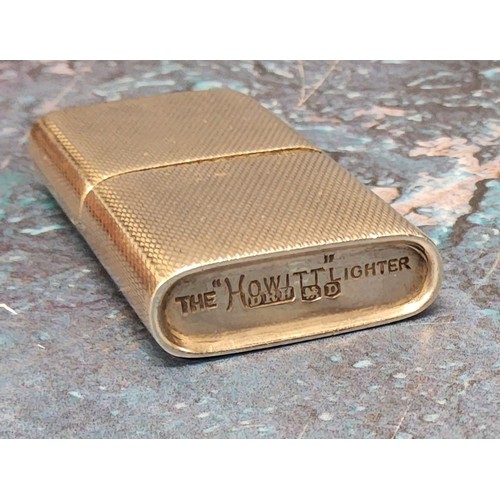 204A - A silver petrol lighter, engine turned decoration, stamped,' The Howitt' , Dudley Russell Howitt, Sh... 