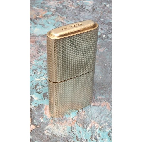 204A - A silver petrol lighter, engine turned decoration, stamped,' The Howitt' , Dudley Russell Howitt, Sh... 