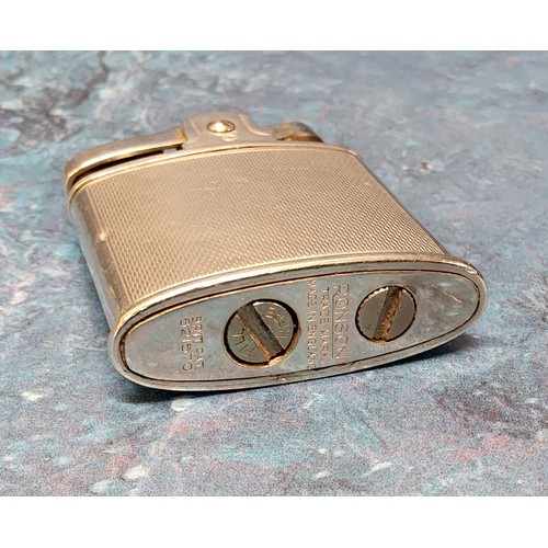 205A - A Sterling Silver Ronson Standard Lighter Brit Pat 821570, the body stamped Sterling Silver