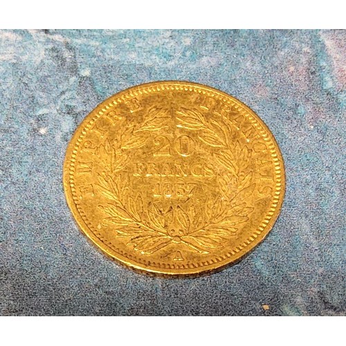 287A - A Napoleon III 20 Francs gold coin, dated 1857, plain head portrait of Napoleon III above BARRE, the... 