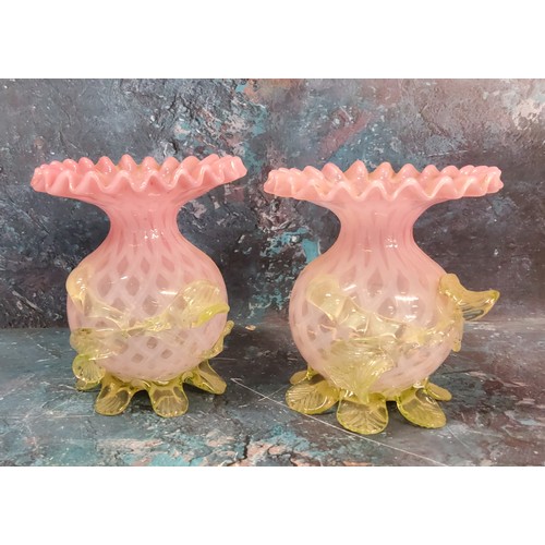 30A - A pair of Victorian satin glass globular vases, with flared frilly rims, applied with vaseline folia... 