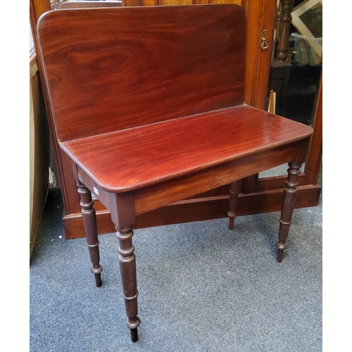 456 - A 19th century mahogany folding tea table, rounded rectangular top, secret compartment, turned legs,... 