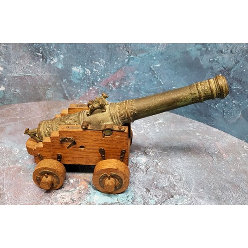 56 - An 20th century bronze replica of Vasa Wasa Sweden 1628  ship's cannon, on oak four wheel ... 