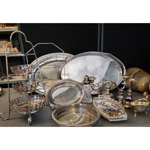 114 - Plated Ware - an E.P.N.S. gallery tray;  an oval tray;  graduated cake stands;  cande... 