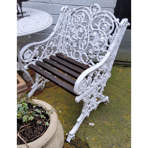 487 - A 20th century Coalbrookdale reproduction bistro set, white painted cast aluminium garden armchairs ... 