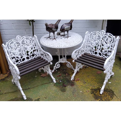 487 - A 20th century Coalbrookdale reproduction bistro set, white painted cast aluminium garden armchairs ... 