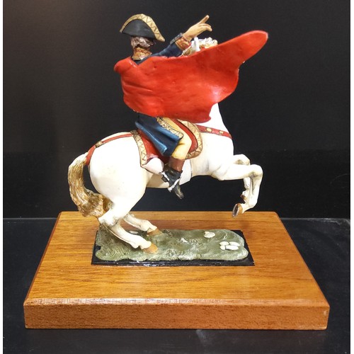 151 - A handpainted die-cast figure of Napoleon on horseback based on the painting by Jacques-Louis David,... 