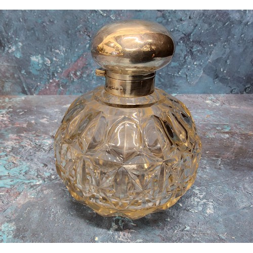 263 - A silver and cut glass dressing scent bottle, hinged silver domed cover, complete with stopper, ... 