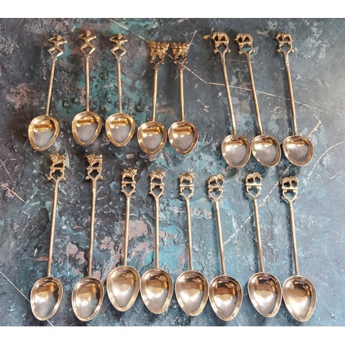 279 - Sixteen Indian tea and coffee spoons, each with mystical beast, elephant or mask terminal