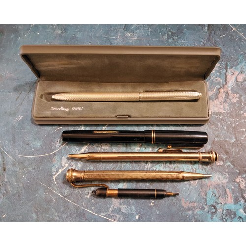 310 - A Swan fountain pen, 14ct nib;  a sterling silver ball point pen;  others