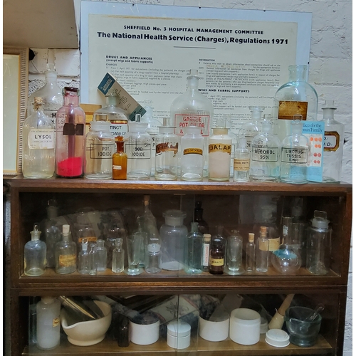 392 - A large collection of Victorian and later pharmaceutical apothecary bottles, cream jars and pestle a... 