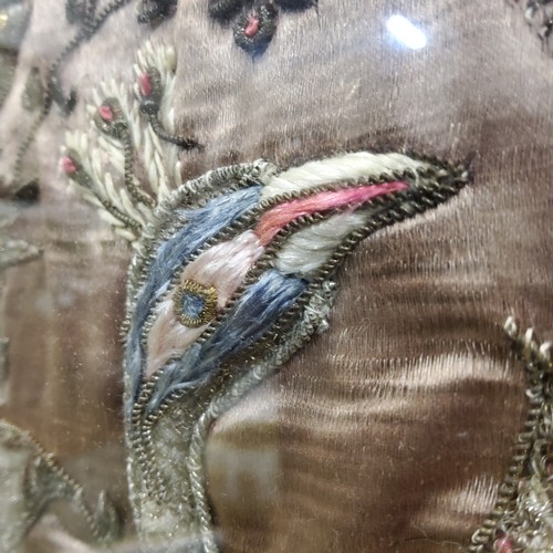 438 - Textiles - An early 20th century Indian silk embroidery of peacocks on the tree of life above the Ta... 