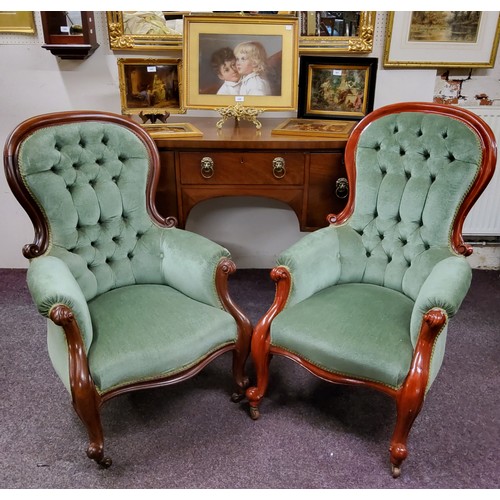 449 - A pair of Victorian mahogany stuffed-over arm chairs