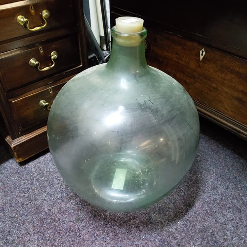 395 - A large glass carboy