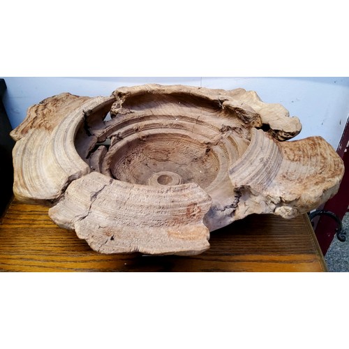 519 - A large natural turned wooden bowl, signed Chai 1990, 54.5cm wide