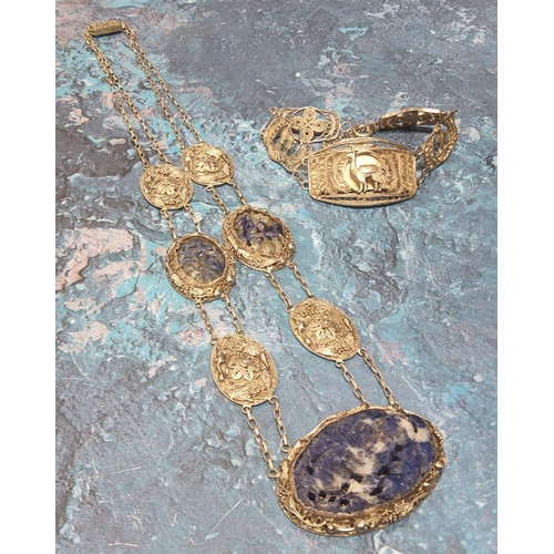 373 - A South American white metal wirework necklace, the central oval wirework panel set with a floral ca... 