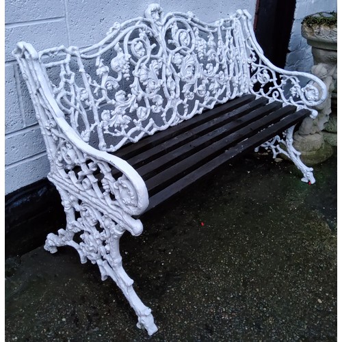 488 - A Coalbrookdale style rustic leaf scroll pattern garden bench, painted white, slatted wood seats on ... 