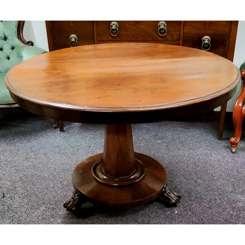 547 - A George III Regency Cuban mahogany tilt top centre table, conical octagonal support, turned to base... 