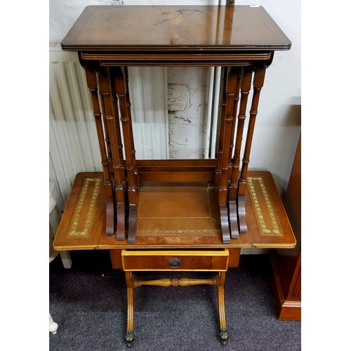 553 - A nest of Regency style occasional tables; a tooled leather inlaid wine table (2)