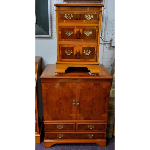 557 - A 20th century yew side cabinet, with two doors above  faux drawers, 90cm high, 74cm wide; ... 