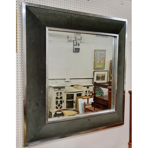 563 - A substantial modern square chromed cushion mirror