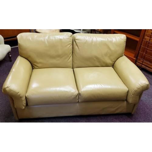 566 - A mid 20th century low studio sofa in vintage butterscotch upholstery