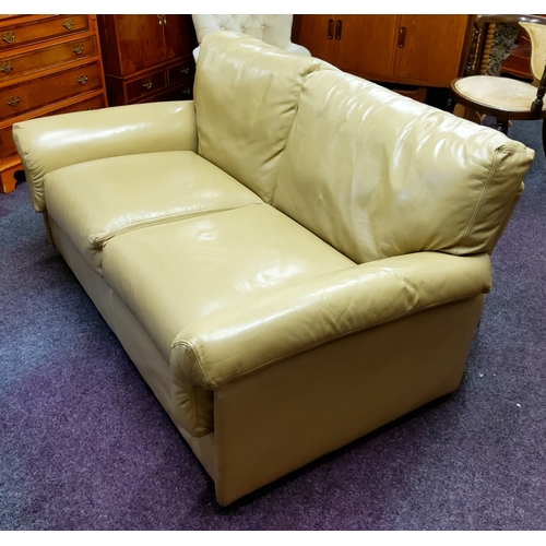 566 - A mid 20th century low studio sofa in vintage butterscotch upholstery