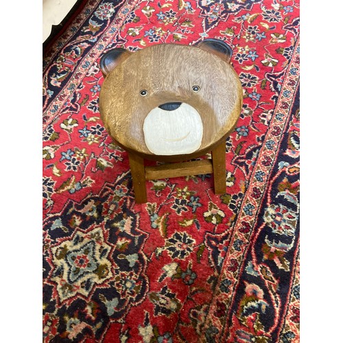 600A - A child's stool, the top carved with a bear's face, 24cm high, 25cm diam;   Board Games - ... 