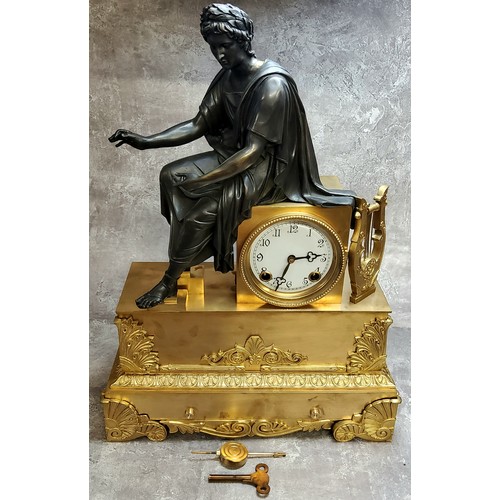 575 - A French gilt metal and bronzed clock, the dial with Arabic numerals, twin winding holes, striking o... 