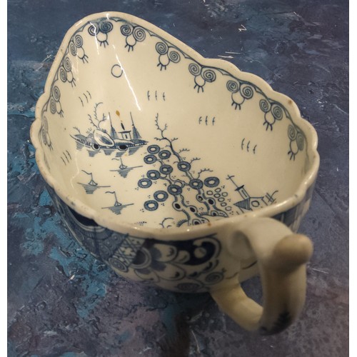 268 - A Worcester Doughnut Tree pattern sauceboat, decorated in underglazed blue, the exterior with foliag... 