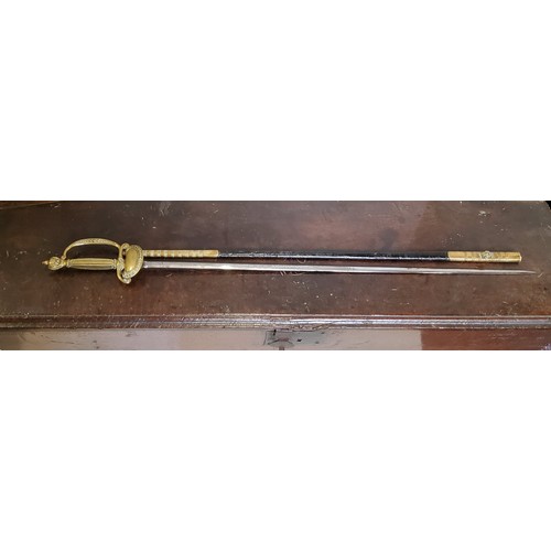 585 - A 20th century dress sword, with gilt metal grip, the 81.5cm long blade etched Griffiths, Mcalister,... 