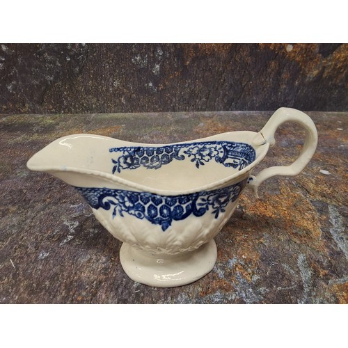 215 - A Liverpool John & Jane Pennington cream jug, moulded in relief with stiff leaves, printed in un... 