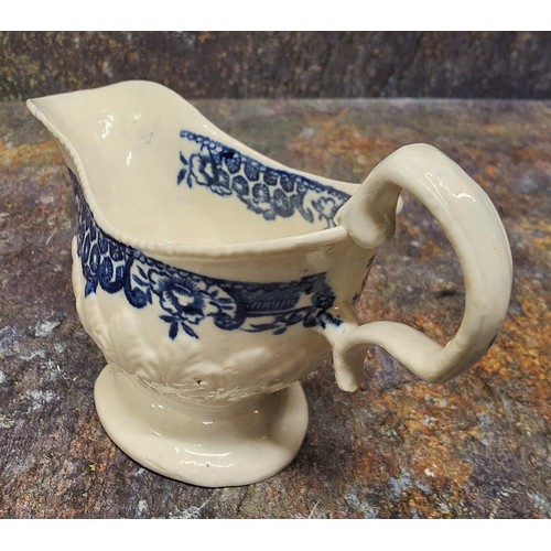 215 - A Liverpool John & Jane Pennington cream jug, moulded in relief with stiff leaves, printed in un... 