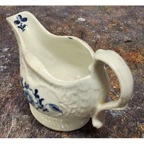 217 - A Liverpool James Pennington strap moulded creamboat, painted in underglaze blue with flowers, bitin... 