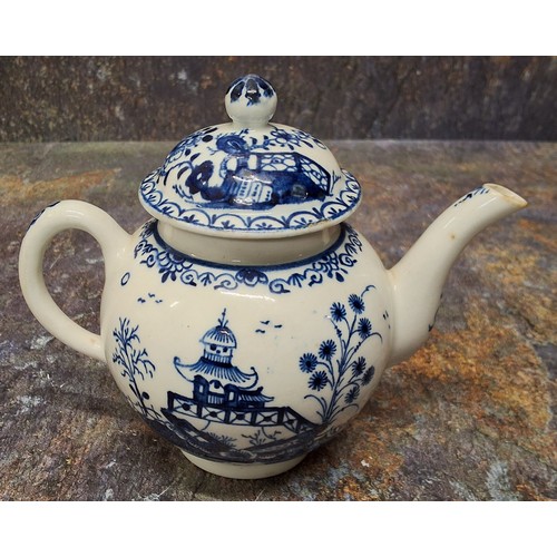 169 - A Lowestoft teapot and cover,  painted in underglazed blue with pagoda and fence, ball finial, 12.5c... 