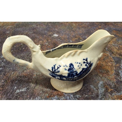 218 - A Liverpool John & Jane Pennington cream jug, moulded in relief with shells, printed in undergla... 