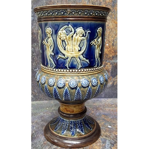 164 - A Doulton Lambeth stoneware water filter, in relief with dancing cherubs, the base with stiff leaves... 