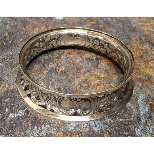 34 - An Irish silver dish ring, pierced with foliate scrolls, 10cm diam,  Edmond Johnson Ltd, , Dublin 19... 