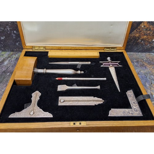 468 - A silver plated Masonic Lodge tool set, by Toyne & Co, comprising various tools, ruler,  gavel, ... 